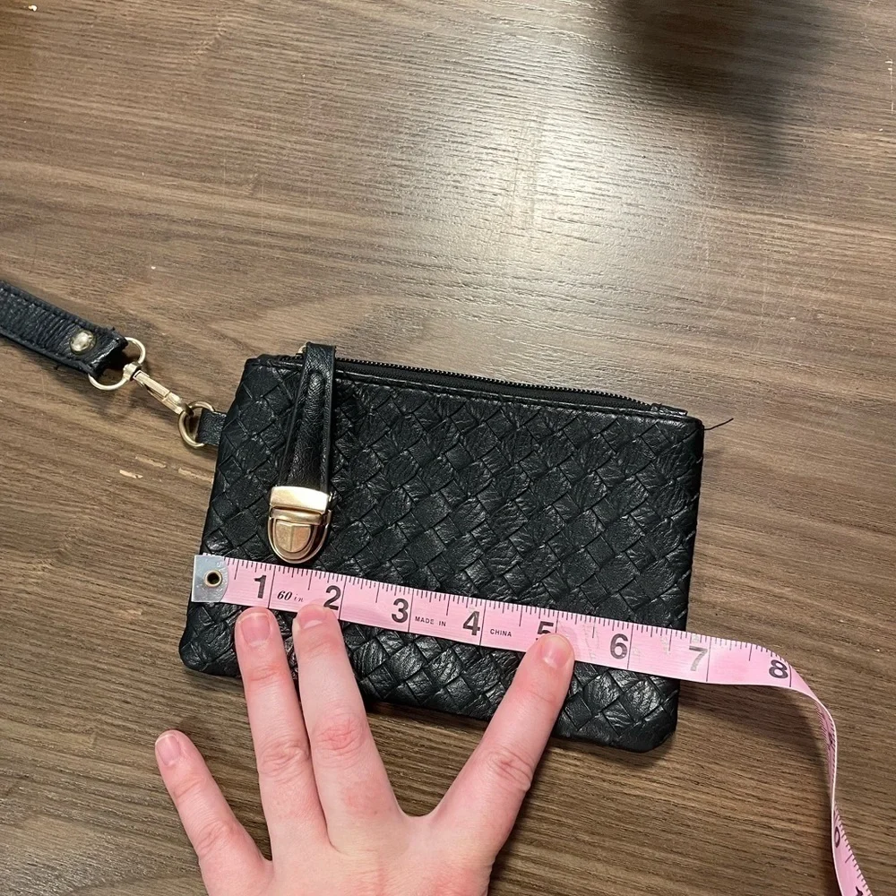 Small Black Pattern Wristlet With Zipper & Metal Clasp Closure.